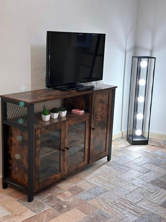 TV a/nebo společenská místnost v ubytování La dimora di Pino