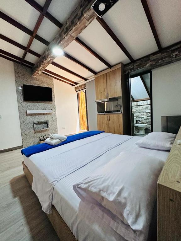 Postel nebo postele na pokoji v ubytování Hotel Lares 70 Laureles