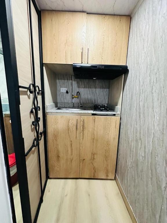 Kuchyň nebo kuchyňský kout v ubytování Hotel Lares 70 Laureles