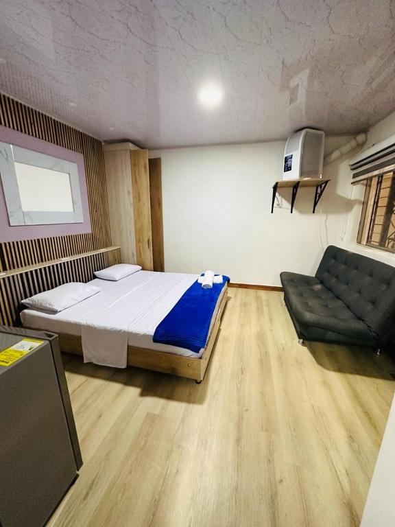 Postel nebo postele na pokoji v ubytování Hotel Lares 70 Laureles
