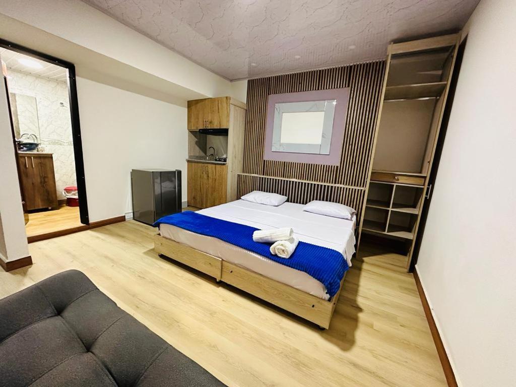 Postel nebo postele na pokoji v ubytování Hotel Lares 70 Laureles