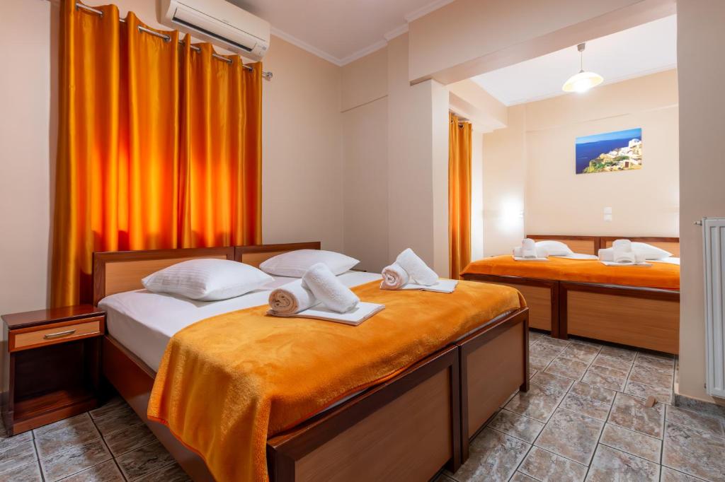Postel nebo postele na pokoji v ubytování Faros I