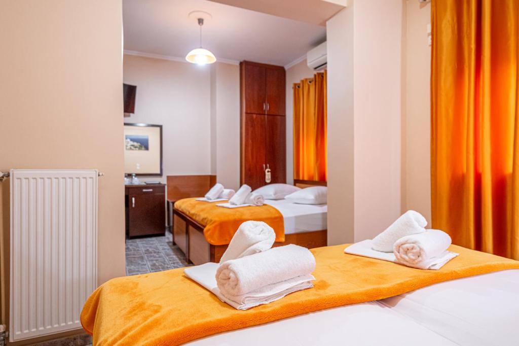 Postel nebo postele na pokoji v ubytování Faros I