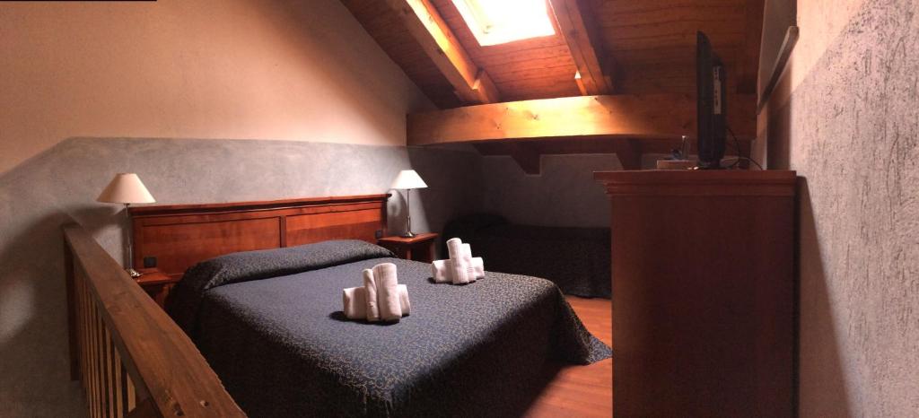 Postel nebo postele na pokoji v ubytování Hotel Clari