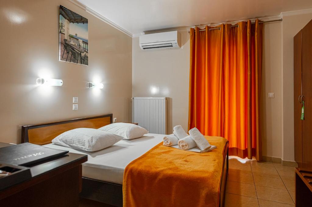 Postel nebo postele na pokoji v ubytování Faros I