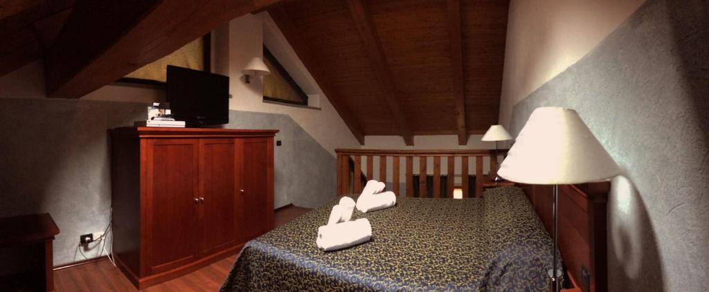 Postel nebo postele na pokoji v ubytování Hotel Clari