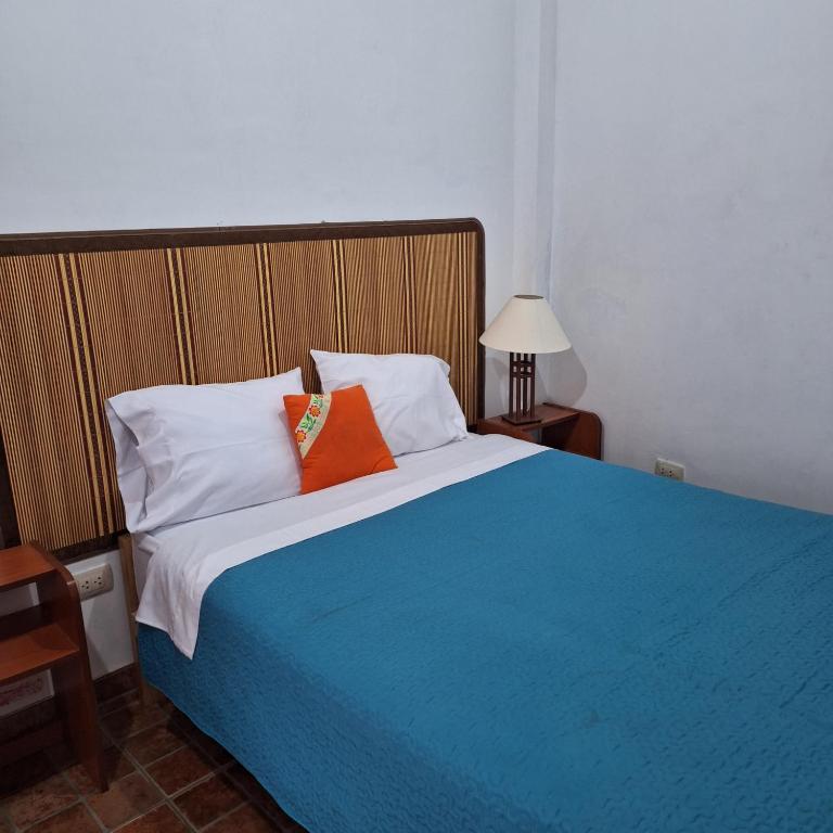 Postel nebo postele na pokoji v ubytování Casa Wayra Cajamarca