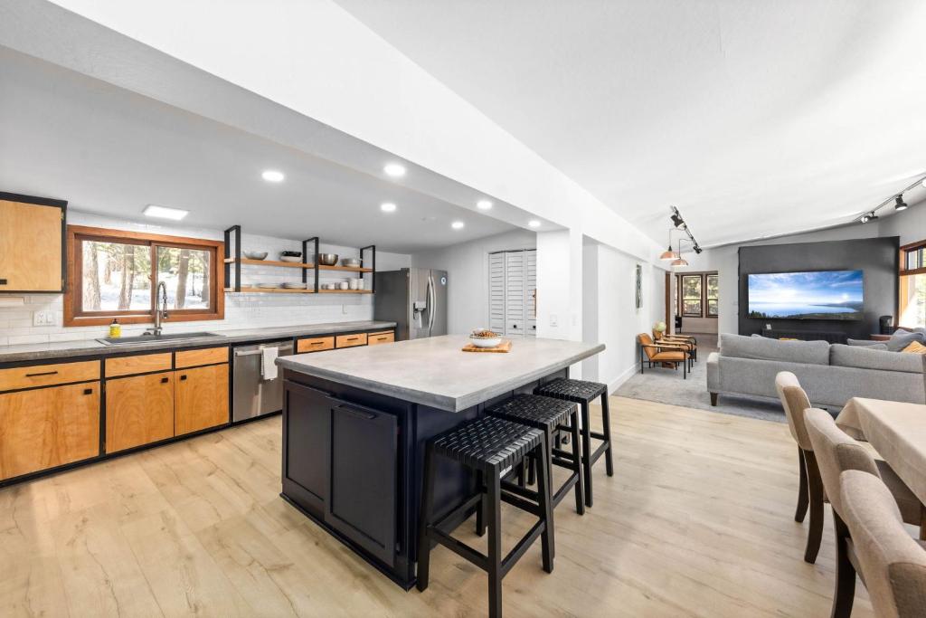 a kitchen and living room with a table and chairs at Sunnyside Retreat - Tahoe City, 4 BR, Pet Friendly, Bonus Room in Tahoe City