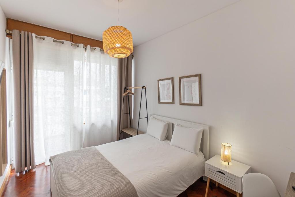 Giường trong phòng chung tại Lolla's City House 2