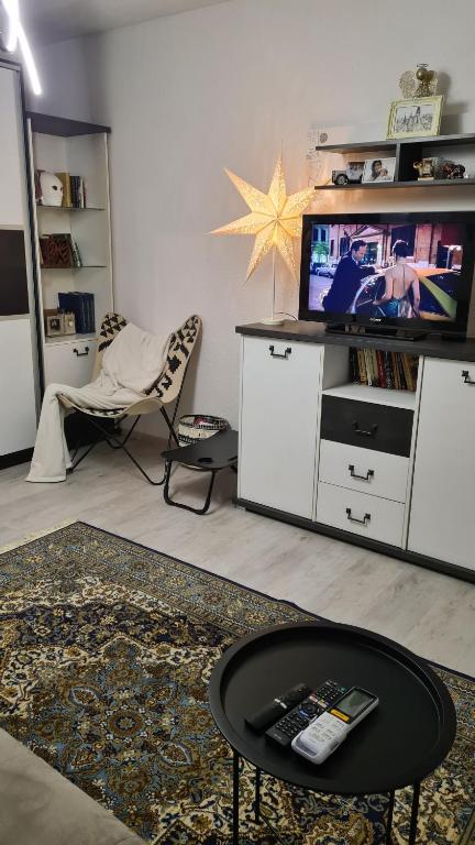 Et tv og/eller underholdning på Peni Apartman Centar