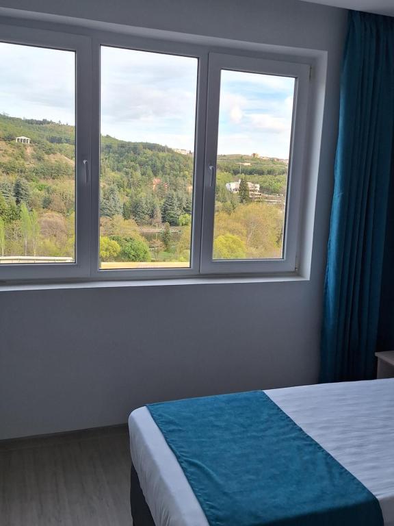 Postel nebo postele na pokoji v ubytování Sandanski park view