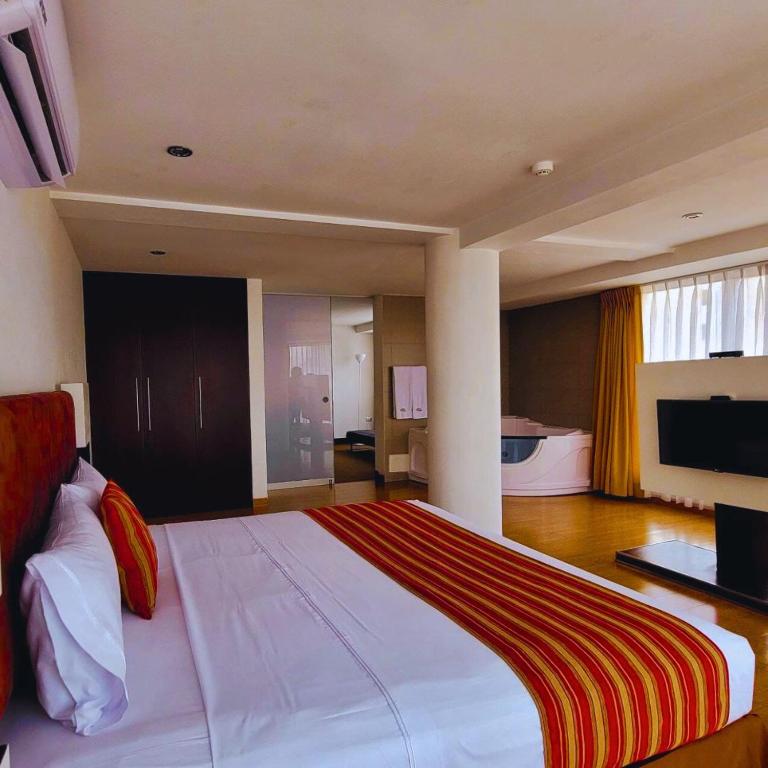 Cama o camas de una habitación en Allpa Hotel & Suites