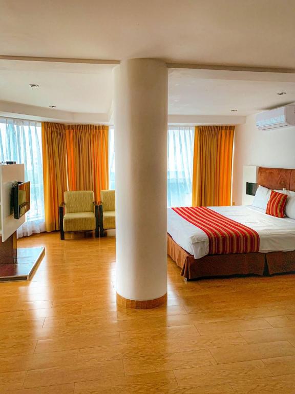 Cama o camas de una habitación en Allpa Hotel & Suites