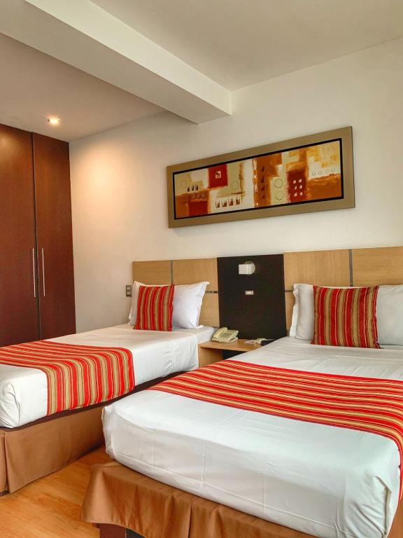 Cama o camas de una habitación en Allpa Hotel & Suites
