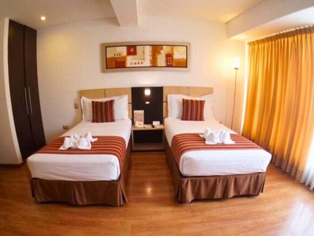 Cama o camas de una habitación en Allpa Hotel & Suites