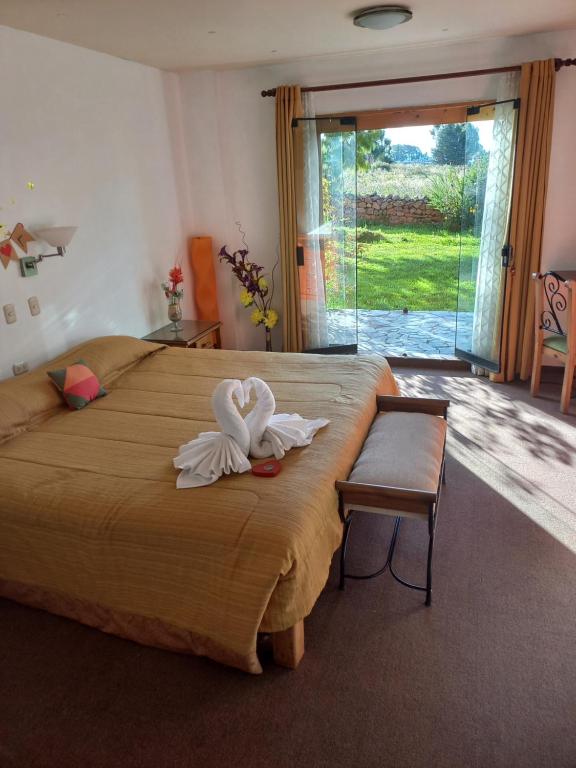 Postel nebo postele na pokoji v ubytování Hotel Pumakala
