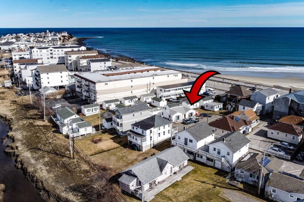 a city with a red arrow pointing to the beach at Hampton Beach Seaside Villa Unit 2 in Hampton