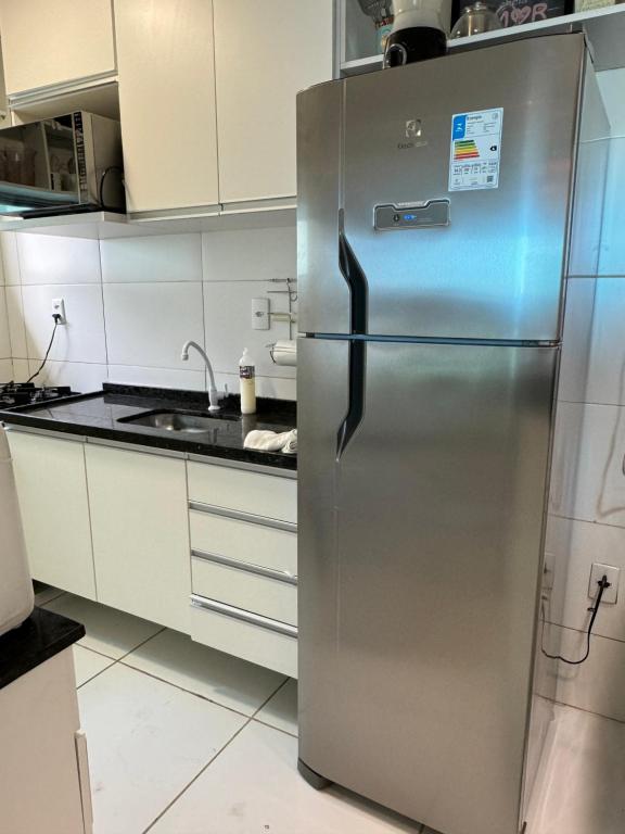 a stainless steel refrigerator in a kitchen at Oportunidade de se hospedar na linda praia do Francês. Apartamento muito aconchegante. in Marechal Deodoro