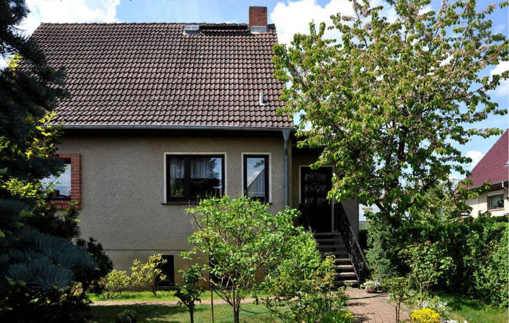 a house with a staircase leading up to it at Beautiful Apartment In Neustrelitz With Kitchen in Neustrelitz