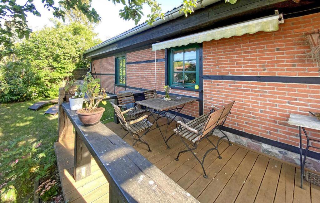 a wooden deck with a table and chairs on it at Beautiful Home In Benz-usedom With Kitchen in Benz