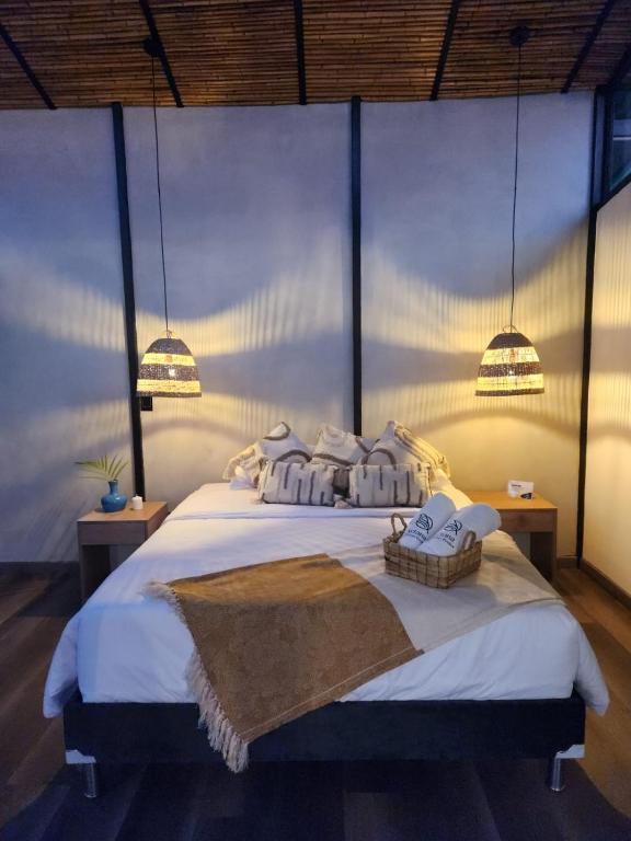 Postel nebo postele na pokoji v ubytování Ketana Eco Hotel