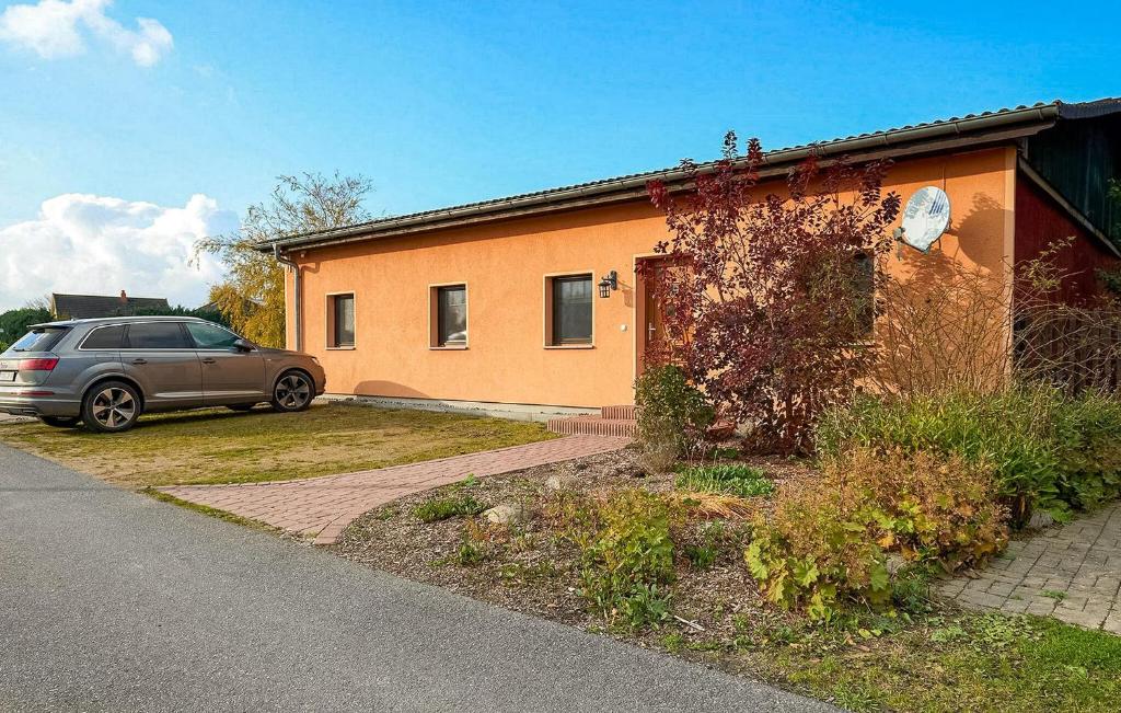 a car parked in front of a house at 2 Bedroom Nice Apartment In Neuendorf in Neuendorf