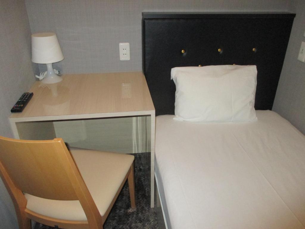Postel nebo postele na pokoji v ubytování Hotel M Matsumoto