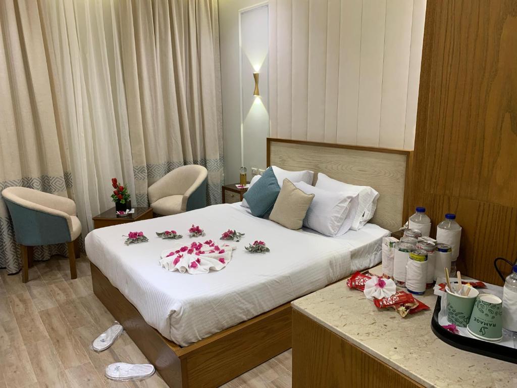 a hotel room with a bed with flowers on it at Ramage Hotel & Resort in Cairo