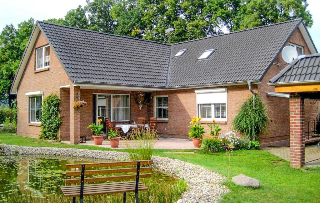 a brick house with a bench in front of it at Gorgeous Apartment In Schwarzenhof With Wifi in Schwarzenhof