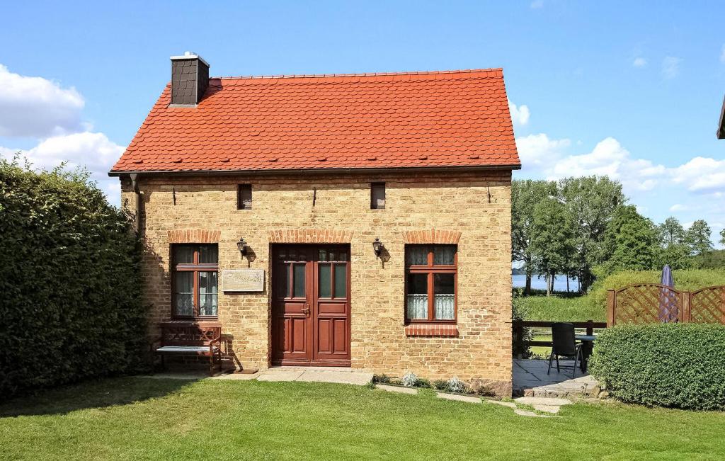 a small brick building with a red roof at Amazing Home In Thomsdorf With Wifi in Thomsdorf