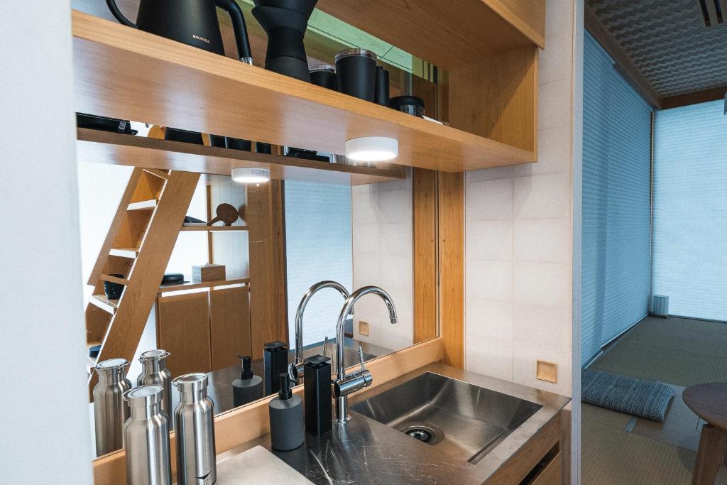 Kuchyň nebo kuchyňský kout v ubytování Moving Inn Tokachi Kitanomori