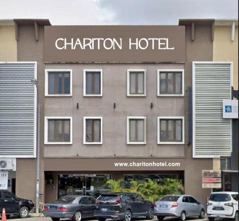a hotel with cars parked in front of it at Chariton Hotel Nusa Bestari in Johor Bahru