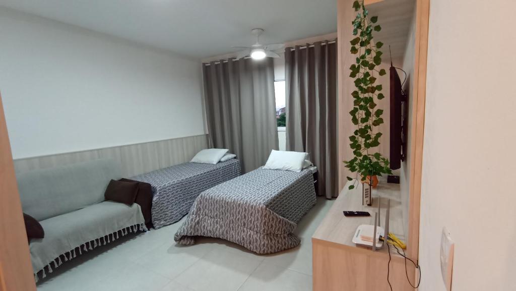 Giường trong phòng chung tại Condomínio da Fé