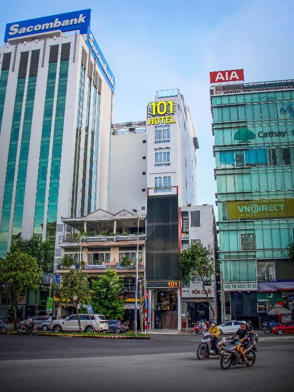 a group of people riding motorcycles down a city street at KHÁCH SẠN 101 CẦN THƠ in Can Tho