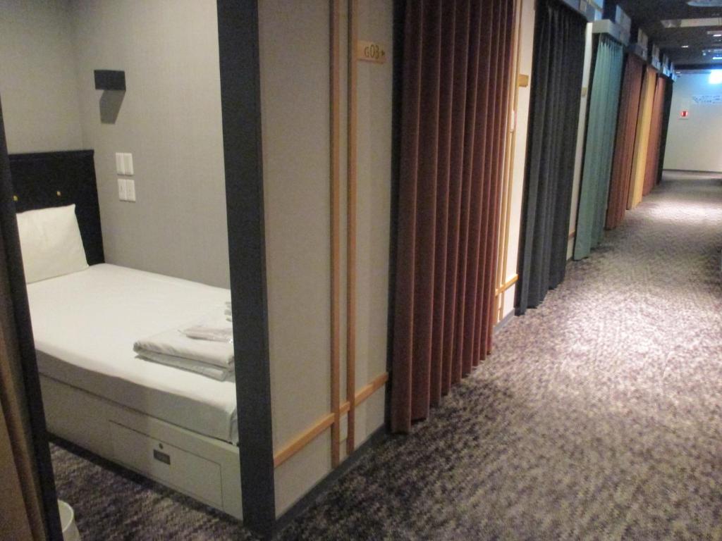 Postel nebo postele na pokoji v ubytování Hotel M Matsumoto