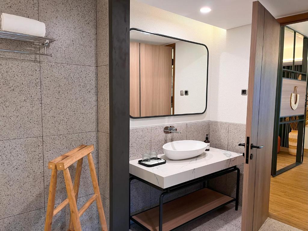 Koupelna v ubytování Luminor Hotel Legian Seminyak - Bali