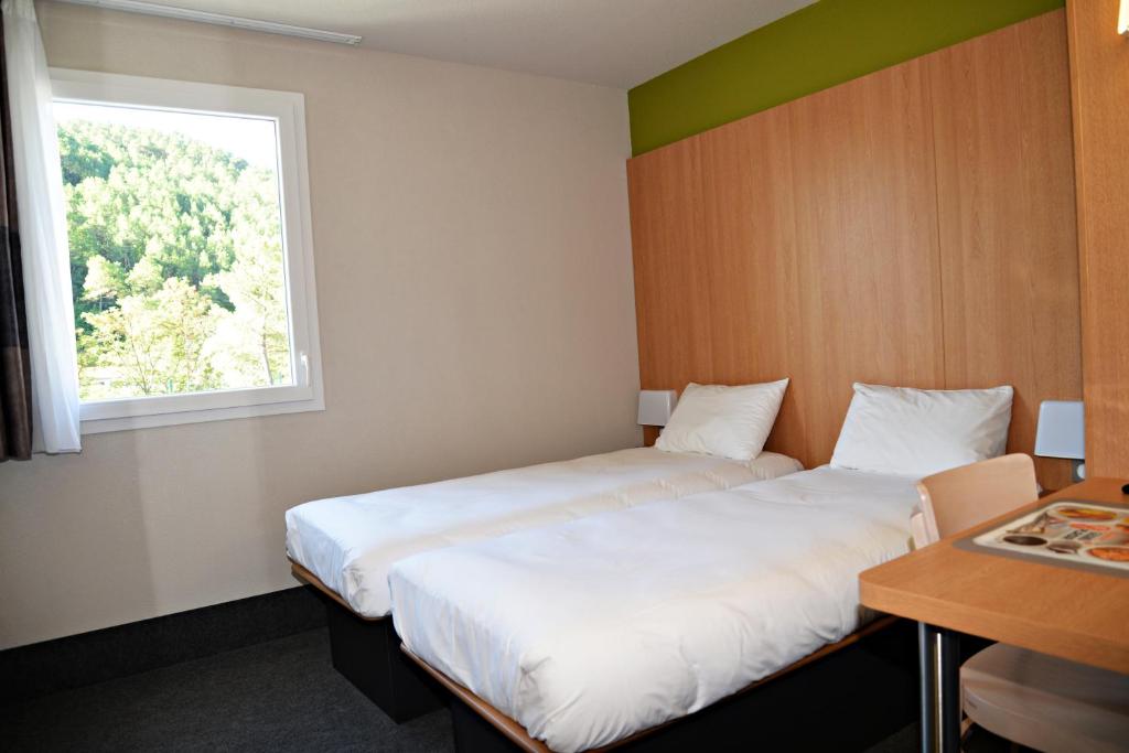 Postel nebo postele na pokoji v ubytování B&B HOTEL Alès - Pôle Mécanique