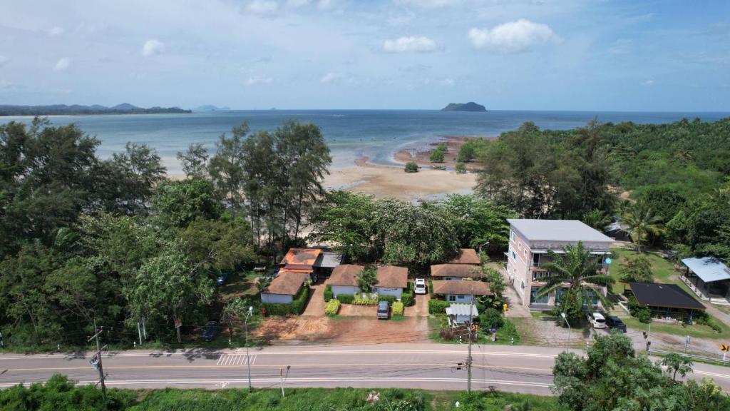 an aerial view of a resort with a beach at พายเนอรี รีสอร์ท @แหล่มแท่น (Pinery Resort) 