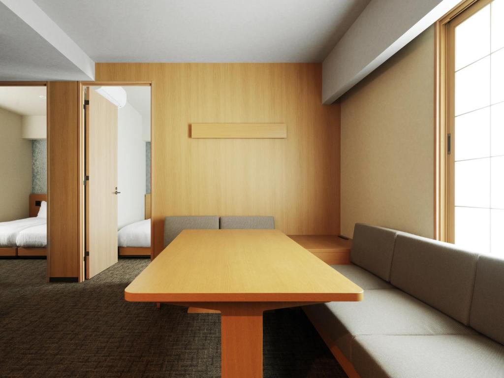 Postel nebo postele na pokoji v ubytování MIMARU Tokyo Station East