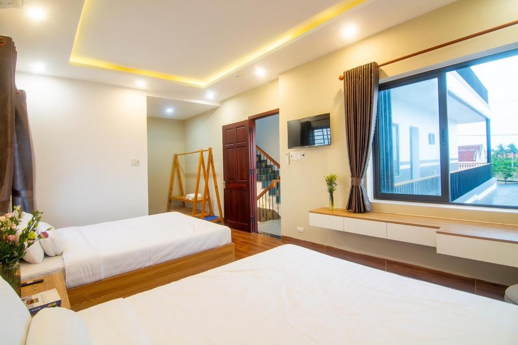 Tai Nhien Homestay - Standard Queen Room With Two Queen Beds