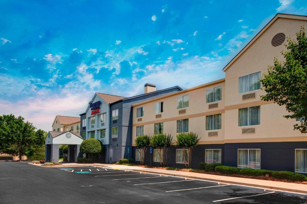 a rendering of a hotel with a parking lot at Fairfield Inn & Suites by Marriott Atlanta Alpharetta in Alpharetta