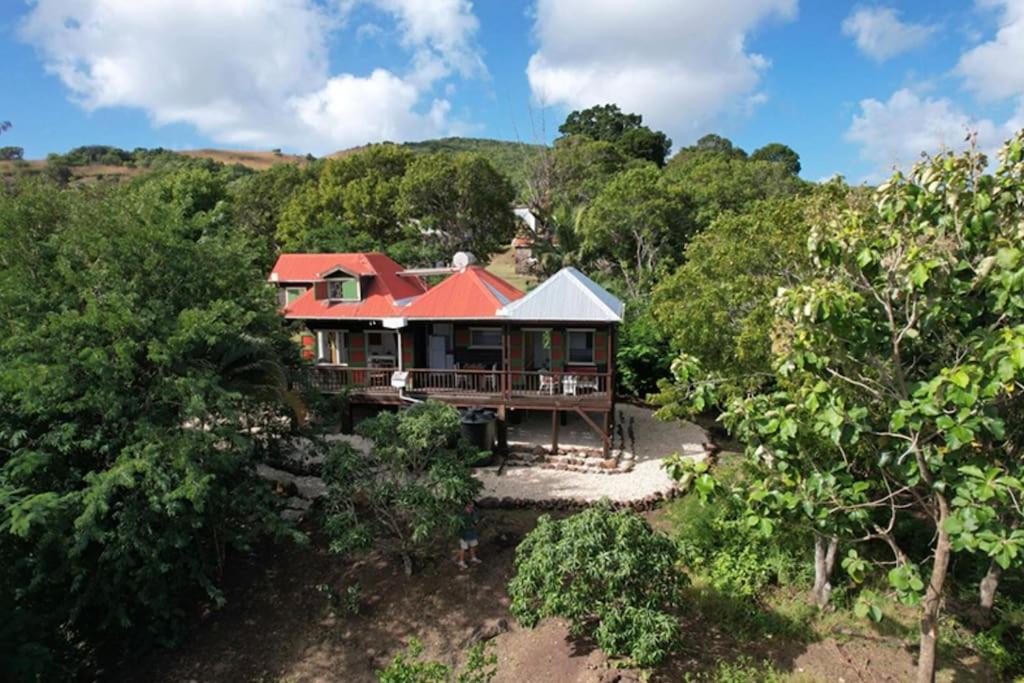an aerial view of a house with a red roof at Sugar Mountain Cottage in Saint Mary