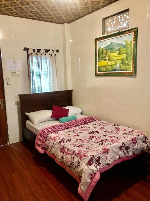 Postel nebo postele na pokoji v ubytování Banana Home Stay Ubud