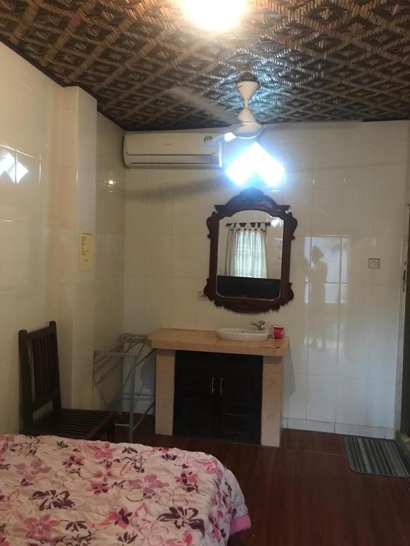 Postel nebo postele na pokoji v ubytování Banana Home Stay Ubud