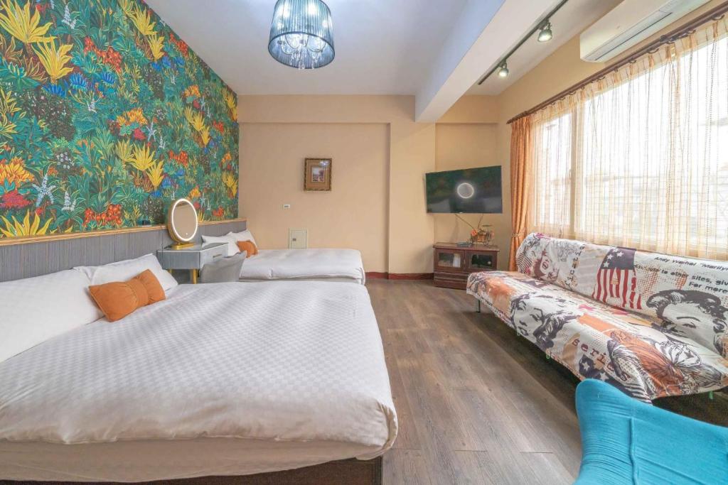 a bedroom with a large bed and a couch at Sunny Homestay in Ji&#39;an