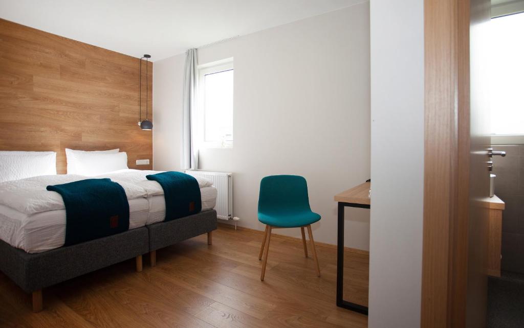 Rúm í herbergi á Stracta Hotel