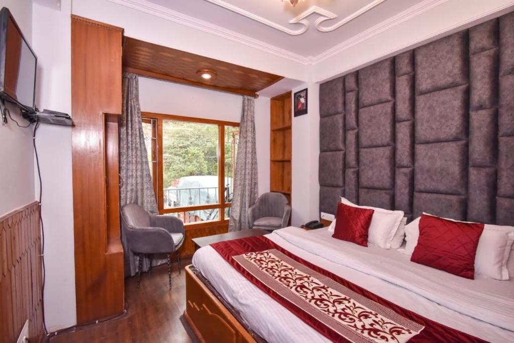 Postel nebo postele na pokoji v ubytování Hotel Avalanche