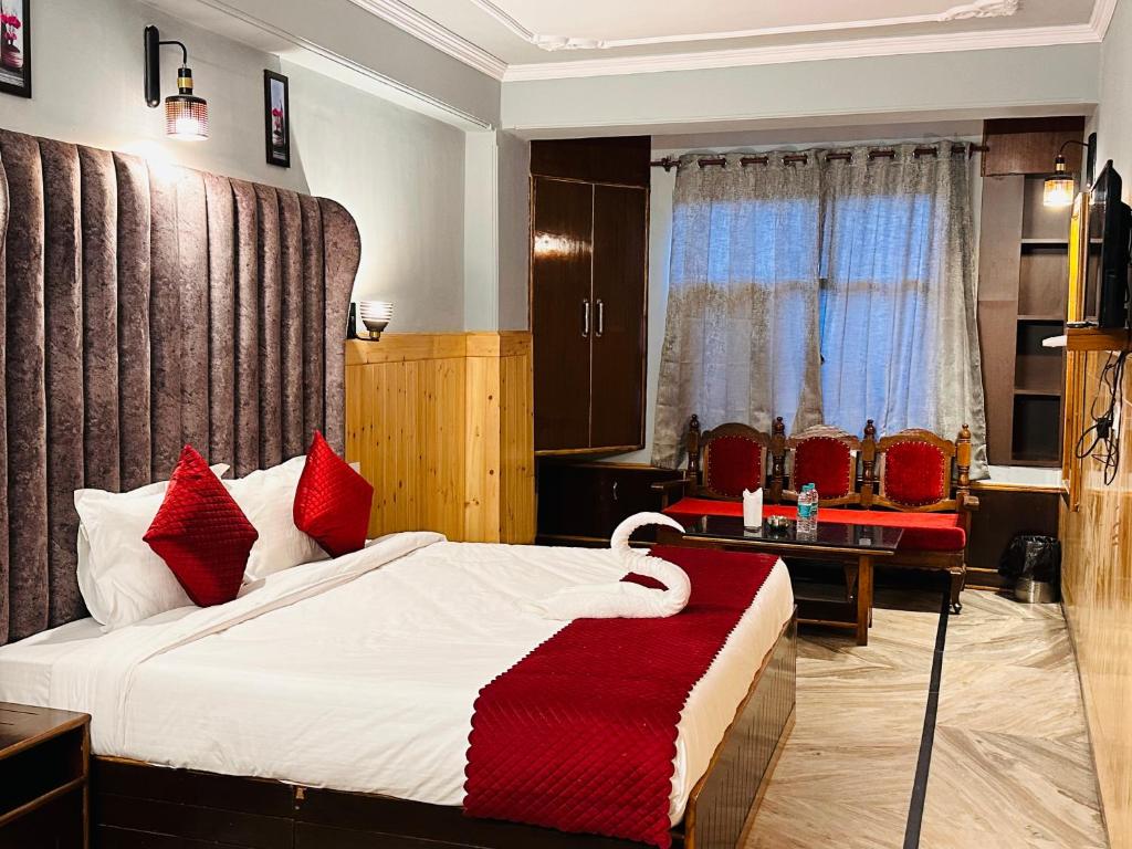 Postel nebo postele na pokoji v ubytování Hotel Avalanche