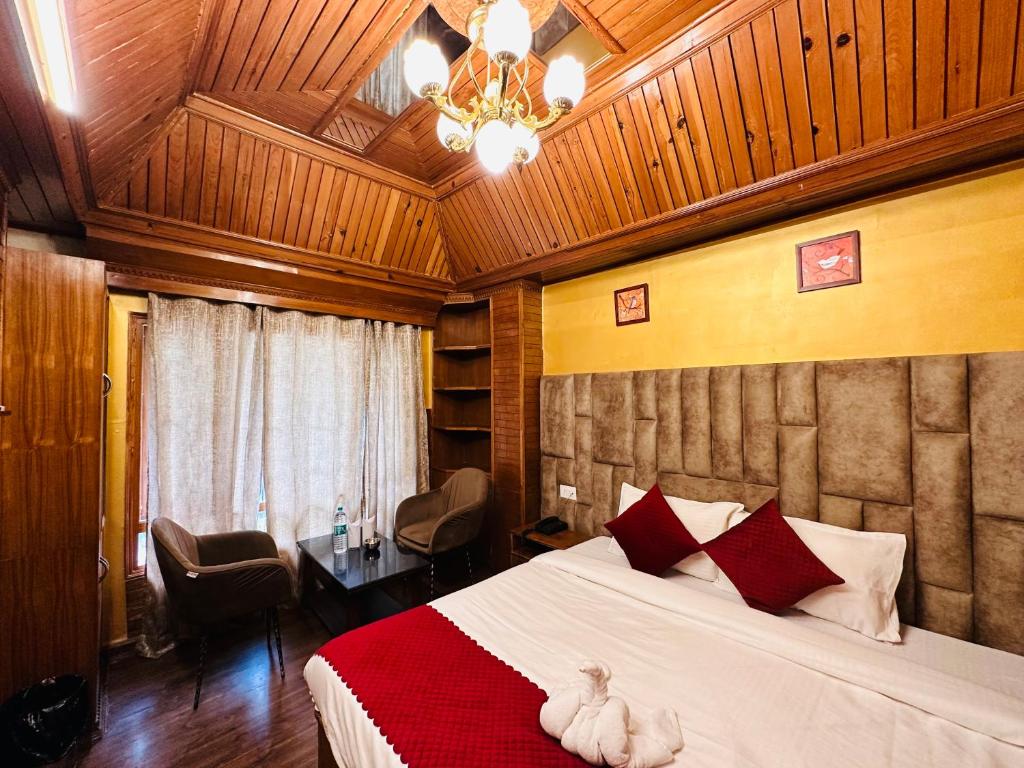 Postel nebo postele na pokoji v ubytování Hotel Avalanche