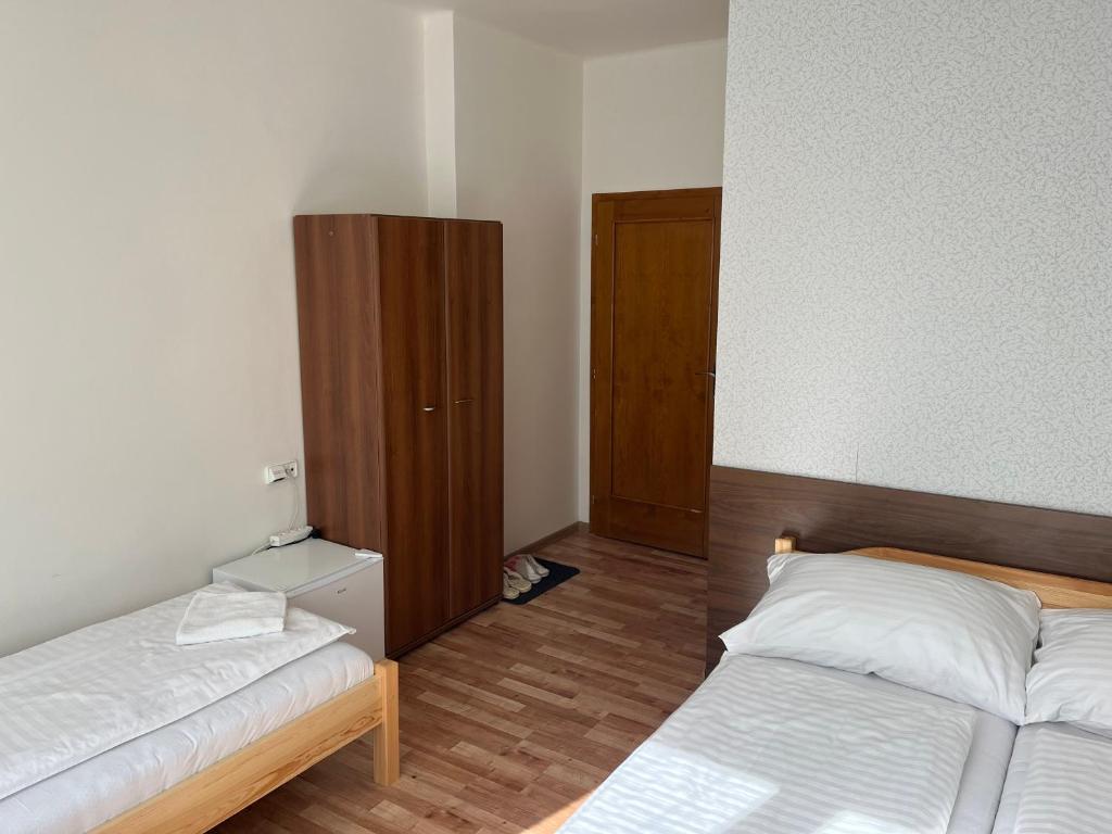 Postel nebo postele na pokoji v ubytování Penzion Znojmo